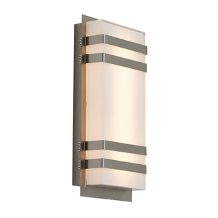 The Artika Glowbox 3 indoor-outdoor LED wall light features a rectangular frosted glass shade with three horizontal metallic bands on a brushed metal backplate, casting a soft, warm glow.
