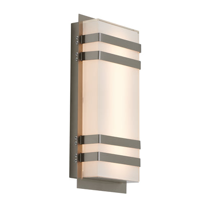 The Artika Glowbox 3 indoor-outdoor LED wall light features a rectangular frosted glass shade with three horizontal metallic bands on a brushed metal backplate, casting a soft, warm glow.