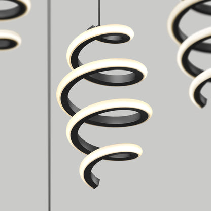 The Artika Chorus 4 Light LED Pendant 5 CCT features a black spiral design with integrated LEDs, shown suspended against a light gray background. A second matching pendant is partially visible on the right.