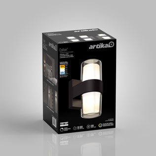 A black box displays an Artika Colton modern LED indoor-outdoor wall light 5 CCT. The box shows a product image, specifications, and icons for brightness, energy efficiency, and lifespan.