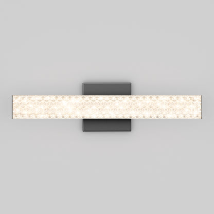 The Adeline modern LED bathroom vanity light 3 CCT by Artika features a rectangular illuminated glass bar on a square, dark base and is shown wall-mounted against a plain gray background.