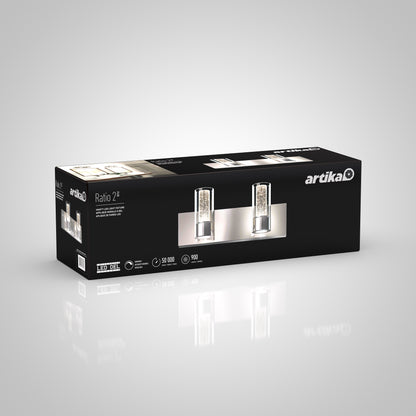 A black and silver box featuring the Artika Ratio 2-light LED bathroom vanity light, complete with product details and branding, set against a white gradient background.