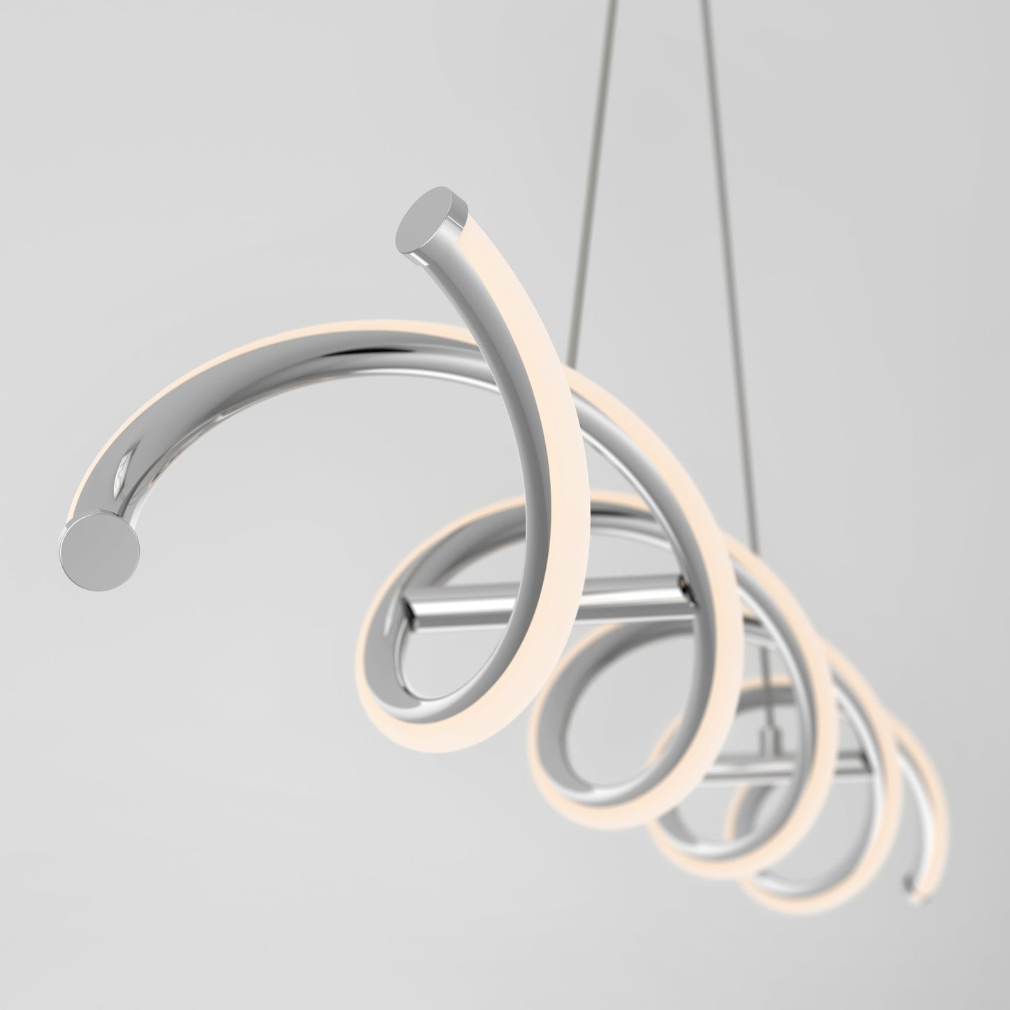The Artika-CAN-dev DNA Linear LED modern pendant light showcases intertwined chrome-finished spiral LED tubes, suspended from the ceiling against a plain light gray background.