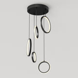 A modern ceiling light fixture with five black circular LED rings hanging at varying lengths from a round black base, against a plain white background.