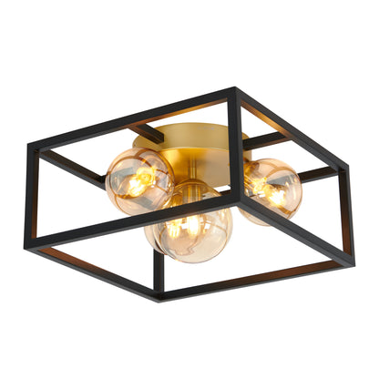 The Artika Griffintown flush mount is a modern ceiling light featuring three exposed round bulbs, a gold central base, and a black open rectangular metal frame.