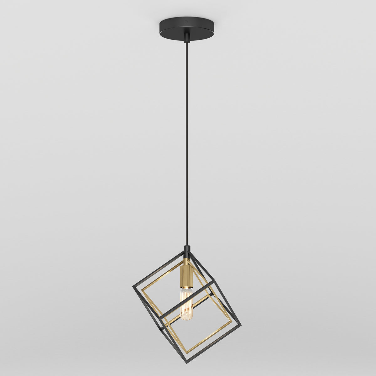A modern pendant light with a black and gold geometric cage design, featuring an exposed bulb hanging from a black cord and ceiling mount against a plain white background.