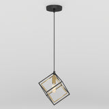A modern pendant light with a black and gold geometric cage design, featuring an exposed bulb hanging from a black cord and ceiling mount against a plain white background.