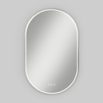 The Artika Royce LED mirror 3 CCT with defogger features an oval shape, a slim illuminated LED border, and three centered touch buttons, mounted on a light gray background.