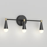 A modern wall sconce with three cone-shaped black and gold light fixtures, each holding a round white bulb, mounted on a circular black base.