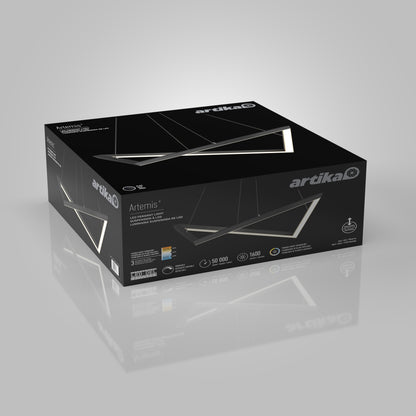 A black Artika Artemis LED pendant light 3 CCT box, featuring product images and features on the packaging, is displayed on a reflective gray surface.