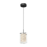 A modern pendant light with a black ceiling mount, a thin black cord, and a cylindrical crystal-like shade inside a clear rectangular outer cover, illuminated and hanging down.