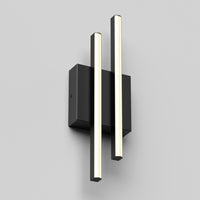 The Artika Grid indoor-outdoor LED wall light features two vertical, parallel black and white light bars on a rectangular black base, shown against a plain light gray background.