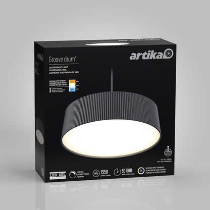 A black box displays the Artika Groove Drum LED contemporary pendant light 3 CCT, showing its ribbed dark shade, glowing white underside, and packaging with product features and specifications.