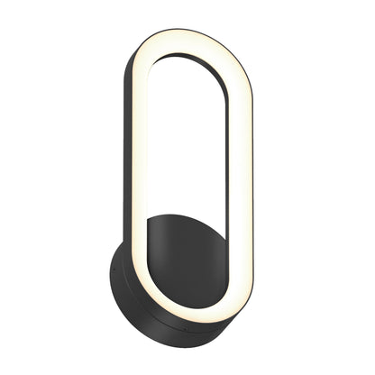 The Artika Aiden modern LED indoor-outdoor wall light 5 CCT features a black circular base and an elongated oval LED frame, emitting a soft warm white glow.