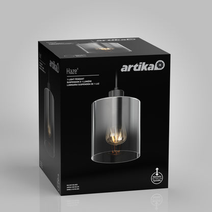 A black Artika box displays the Haze pendant light glass with an exposed bulb and clear glass design. The packaging features product and installation info in English, French, and Spanish.