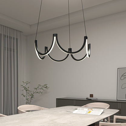 A modern dining room features a marble table, light wood chairs, a minimalist black sideboard, a potted plant, and Artika’s Adelia LED pendant light 5 CCT—a sculptural black and white chandelier—hanging from the ceiling.