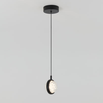 The Avalon LED 1-light pendant by Artika features a round black ceiling base, slender black cord, and a circular textured illuminated shade.