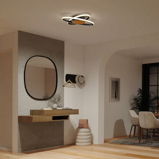 Modern entryway with a round mirror, wood shelf, and Artika Atomic 15 in. LED ceiling light; dining area in the background.