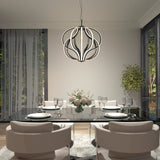 A modern dining room with a glass table set for six, beige upholstered chairs, a large contemporary chandelier, floor-to-ceiling windows with sheer curtains, and a potted plant in the corner.