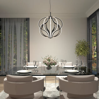 A modern dining room features a glass table for four, beige chairs, a floral centerpiece, large windows with sheer curtains, a potted plant, and the Artika Meridian LED pendant light hanging overhead.