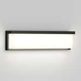 A modern rectangular wall sconce with a black frame and a frosted white diffuser, mounted on a light gray wall and emitting a soft, even glow.