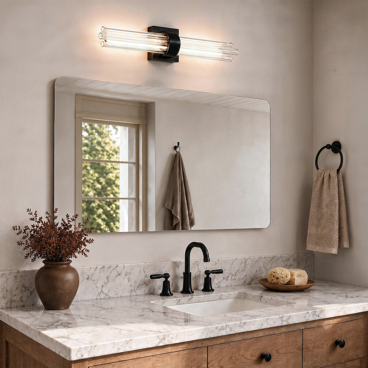 Modern bathroom with marble counter, black faucet, and Artika Dorado 27 in. LED vanity 5CCT lighting the rectangular mirror above.