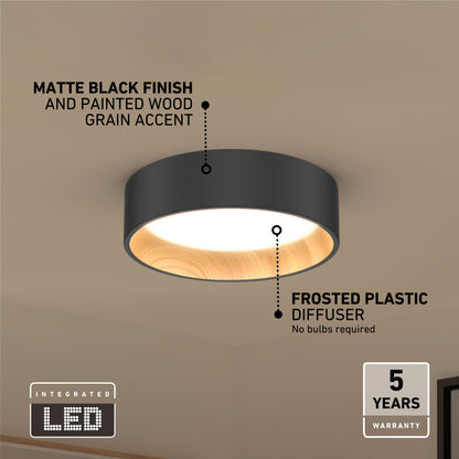 The Artika Alton LED flush mount is a matte black ceiling light with a painted wood grain accent and frosted diffuser. This dimmable fixture has an integrated LED, no bulbs needed, and comes with a 5-year warranty.