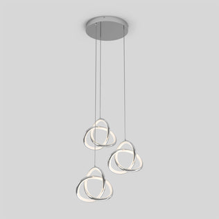 The Artika Zephyr 3-light LED pendant features three intertwined metallic loop lights with integrated LEDs, suspended from a round ceiling mount against a plain light gray background.