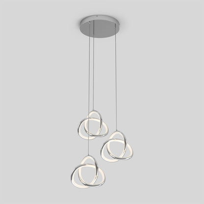 The Artika Zephyr 3-light LED pendant features three intertwined metallic loop lights with integrated LEDs, suspended from a round ceiling mount against a plain light gray background.