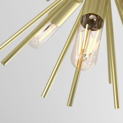 Close-up of the Artika Nebula 6-light pendant, a modern gold fixture featuring exposed vintage-style filament bulbs and multiple metallic rods radiating outward, set against a plain light gray background.