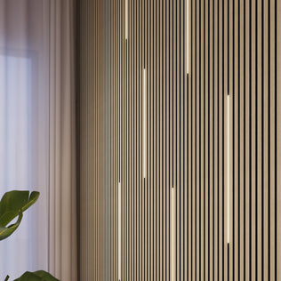 Artika's Lumilok LED Wall Panel Light for Sonolok with remote, sheer curtain, and a leafy plant in the corner.