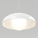 A modern white pendant lamp with a dome-shaped shade, hanging from the ceiling, emits a bright glow against a plain light gray background.