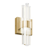 A modern wall sconce with a brushed gold rectangular base and central band, featuring vertical clear glass rods arranged in a symmetrical, cylindrical pattern around the light source.