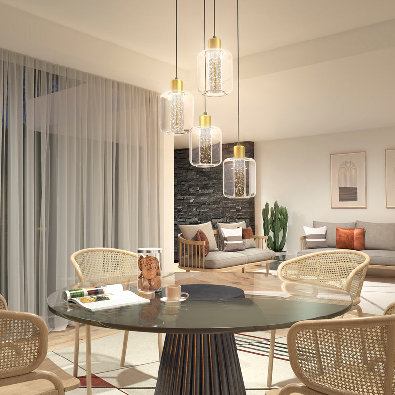 Modern living and dining area featuring a round glass table, four rattan chairs, the Artika Champagne Globe 4-light LED pendant, a cozy sitting area with stone accent wall, framed artwork, cactus plant, and large sheer curtains.