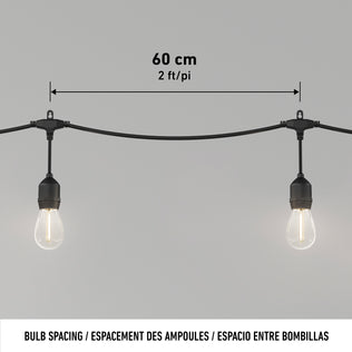 Artika Blaze 20 LED Outdoor Solar String Lights feature weather-resistant bulbs spaced 60 cm (2 ft) apart. “Bulb Spacing” is labeled in English, French, and Spanish—ideal for your outdoor solar string lights.