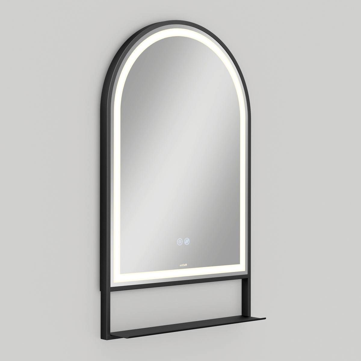 A wall-mounted, arched mirror with a black frame, built-in LED lighting around the edge, and a small black shelf at the bottom against a plain light gray background.