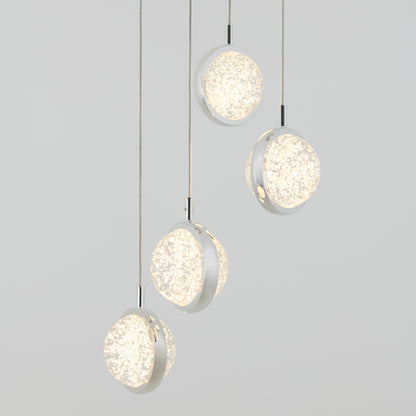 The Artika Avalon 4-light LED pendant features frosted, textured glass shades hanging at various heights against a light gray background, casting a soft, warm glow.