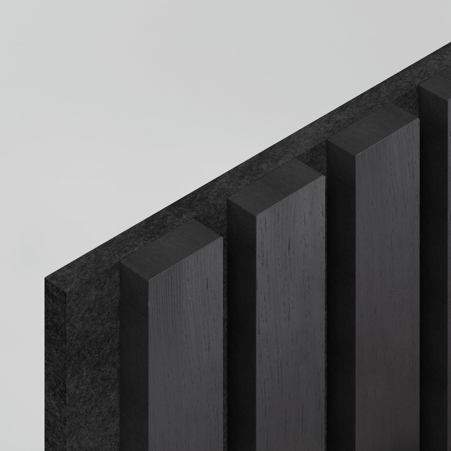 Close-up of an Artika-CAN-dev Sonolok 15.5 ft sound-absorbing wall panel kit, showing its dark, angular matte finish and vertical rectangular slats for a geometric, modern look against a light grey background.