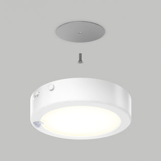 The illuminated Accent under cabinet LED light 3CCT by Artika is displayed below a gray mounting plate and screw, demonstrating installation against a plain gray background.