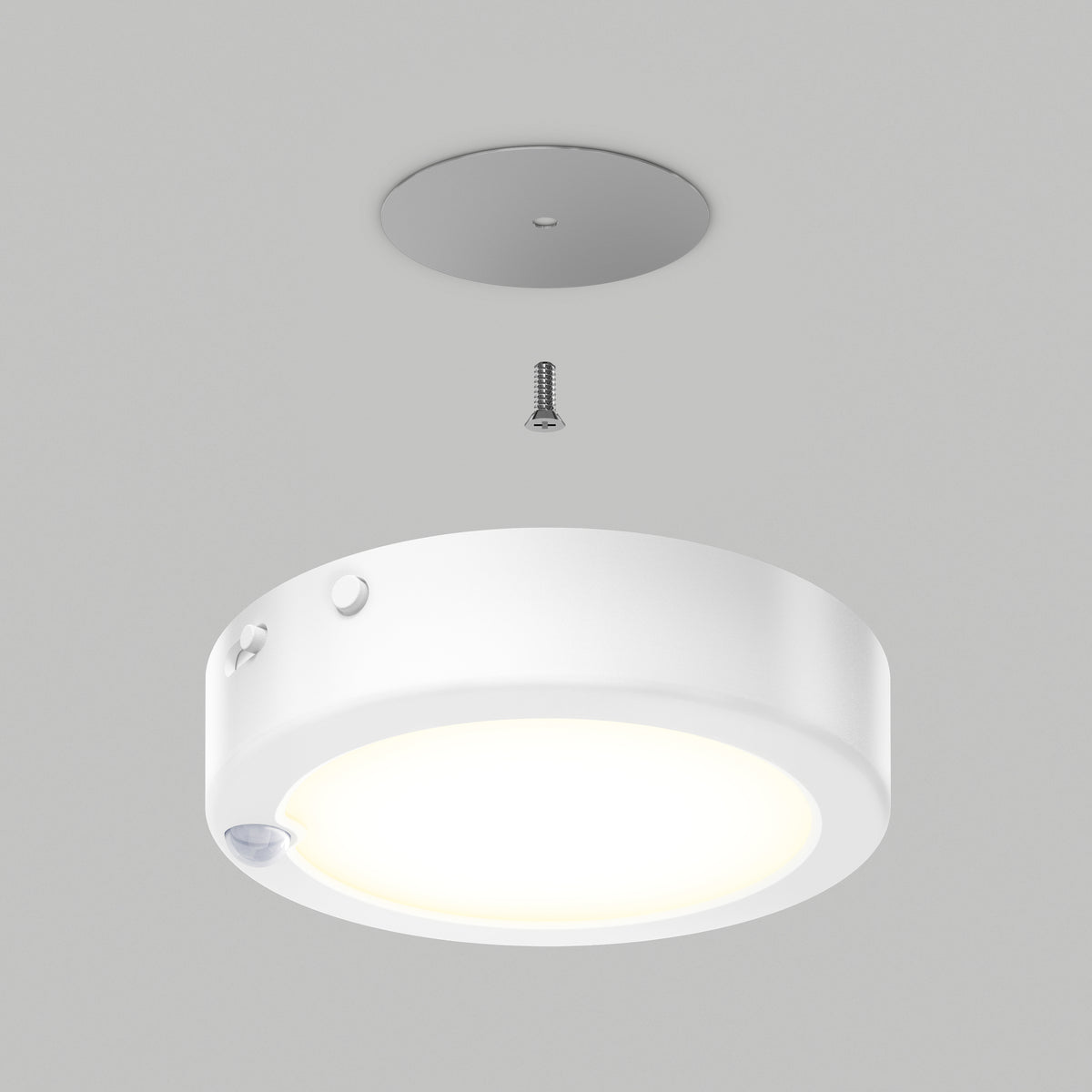 A round, white ceiling light fixture is shown being installed with a single screw and a circular mounting plate on a gray ceiling. The light is illuminated, and the components are aligned vertically.
