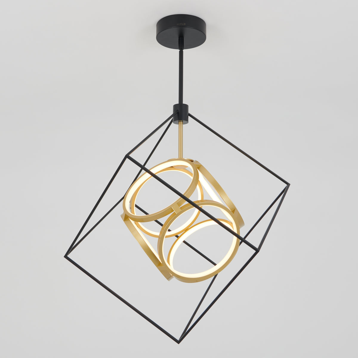 The Artika Luxury LED pendant light features a black metal cube frame with two gold rings and built-in LEDs, suspended from a black ceiling mount against a white background.