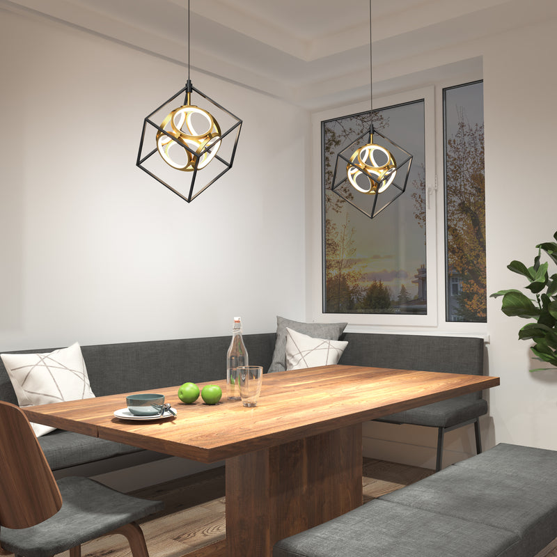 Modern dining nook with a wooden table, gray cushioned benches, an Artika Mini Luxury LED pendant light, glass bottle, glasses, and green apples on the table. A large window reveals trees in autumn.