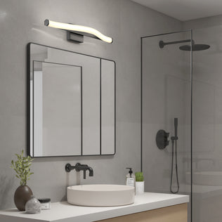 Modern bathroom with a large mirror, vessel sink, glass shower, minimal decor, and Artika’s Arc 27-in Integrated LED Vanity Light Bar.