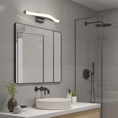 Modern bathroom featuring a rectangular mirror above a white sink, black fixtures, a curved Artika Arc modern LED bathroom vanity light 5 CCT, glass shower enclosure, and minimalist decor with a small plant.