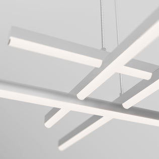 The Artika Grid modern LED pendant light 5 CCT hangs from the ceiling with minimalist white fixtures, featuring clean, straight lines and a geometric aesthetic against a light gray background.