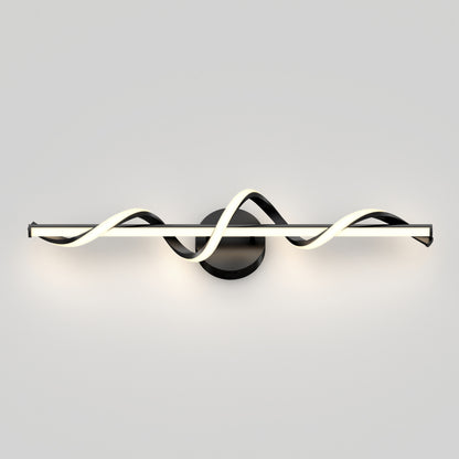 The Artika Coda modern LED bathroom vanity light features a wavy, glowing white LED strip intertwined around a horizontal black bar, mounted on a circular black base against a plain light gray wall.