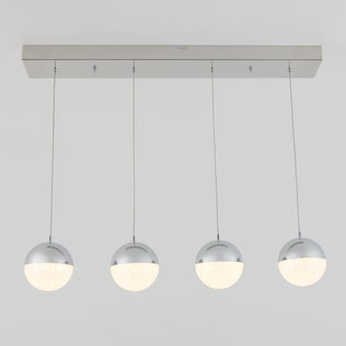 The Artika Sparkle 4-light LED pendant features four spherical lights with chrome tops and frosted bottoms, suspended in a row from a rectangular ceiling mount against a plain white background.