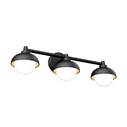 The Artika Boden LED mid-century bathroom vanity light features three black dome-shaped shades with white glass globes, mounted on a horizontal bar.