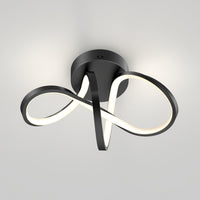 The Artika Loop modern LED flush mount light 3 CCT features a dimmable infinity-loop design on a white ceiling.