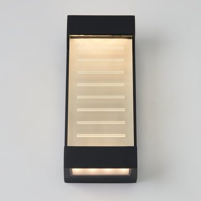 The Percy LED indoor-outdoor wall light by Artika features a modern rectangular black frame, frosted glass panel, horizontal illuminated lines, and warm LED lighting, shown mounted on a light gray wall.